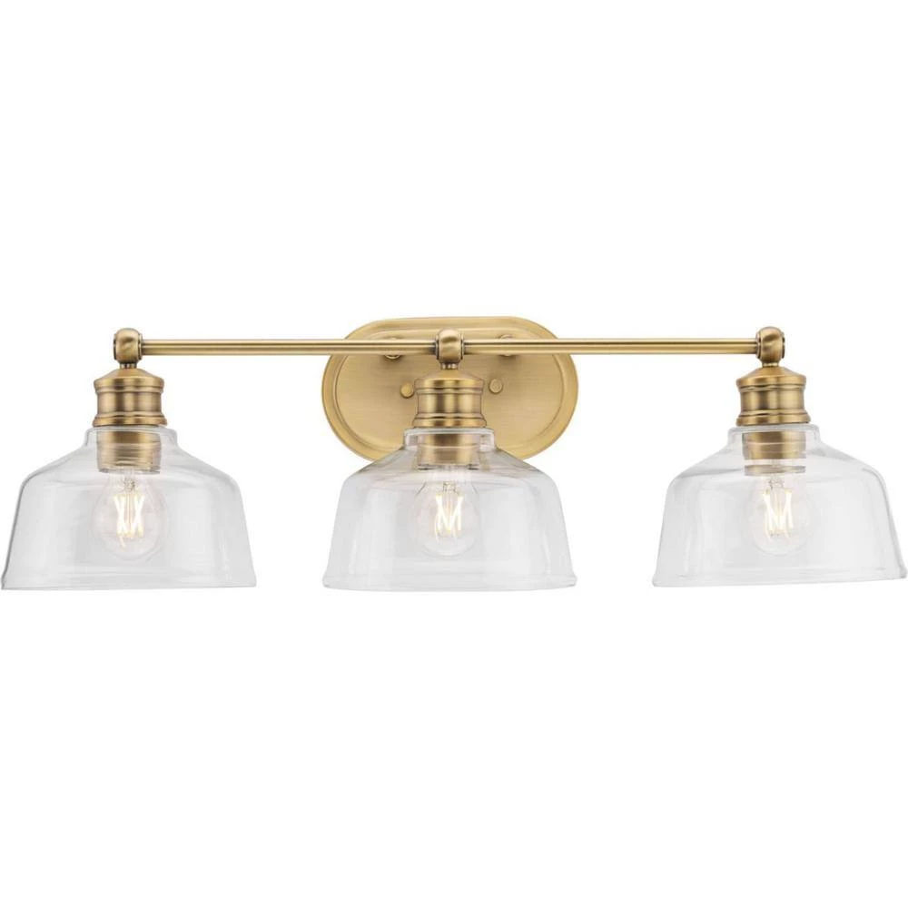 Singleton 26.5 in. 3-Light Vintage Brass Vanity Light with Clear Glass Shades by Progress Lighting 6 Singleton 26.5 in. 3-Light Vintage Brass Vanity Light with Clear Glass Shades by Progress Lighting - Image 4